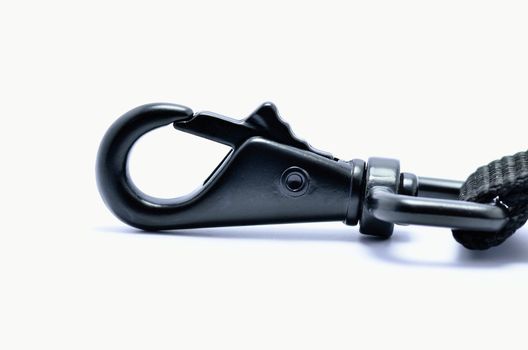 A black hook or clasp for fastening.