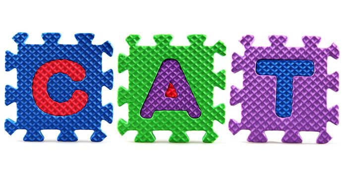 Alphabet puzzle pieces on white background