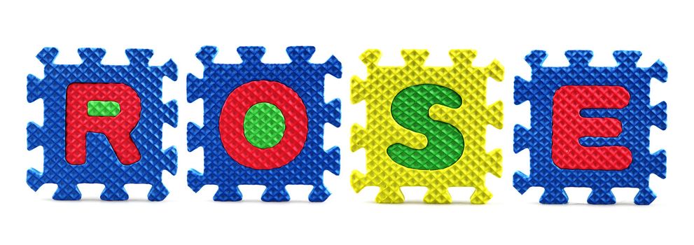 Alphabet puzzle pieces on white background