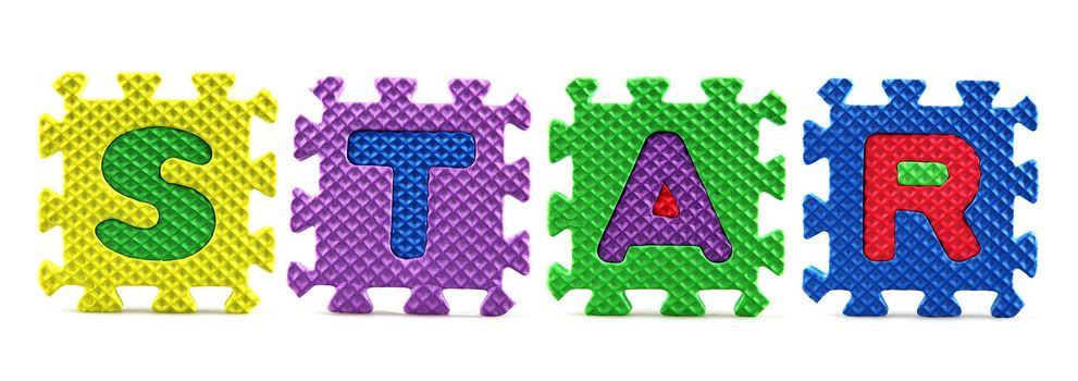 Alphabet puzzle pieces on white background