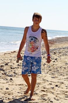 teenage boy by the sea at cromer england