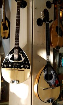 Bouzouki hanging on a wall to be sold at a market