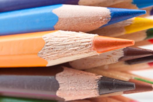 Group of colored pencilson. Closeup, macro photo.