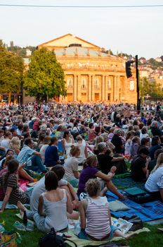 STUTTGART, GERMANY - JULY 25: More than 5.000 people are watching the public viewing of the premiere of Mozart´s opera “Don Giovanni” on a large screen in front of the Opera building in Stuttgart, Germany on July 25, 2012.