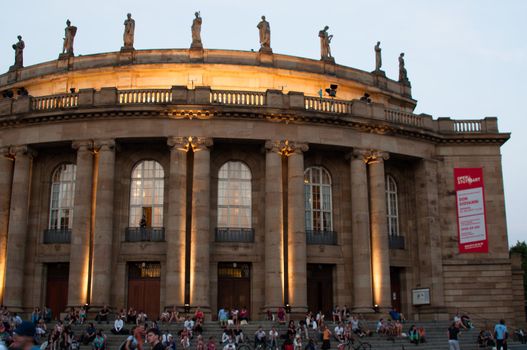 STUTTGART, GERMANY - JULY 25: More than 5.000 people are watching the public viewing of the premiere of Mozart´s opera “Don Giovanni” on a large screen in front of the Opera building in Stuttgart, Germany on July 25, 2012.