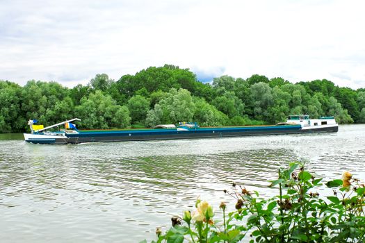 Loaded barge floating in the canal. Netherlands