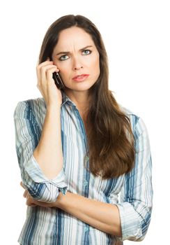 An annoyed and very disappointed business woman on the phone. Isolated over white.
