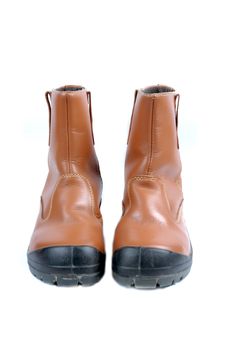 a pair of brown leather boots isolated on white background
