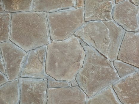 Background and texture from a wall trimmed with a stone