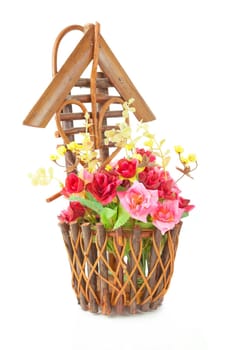 Wood basket roses isolated on white background