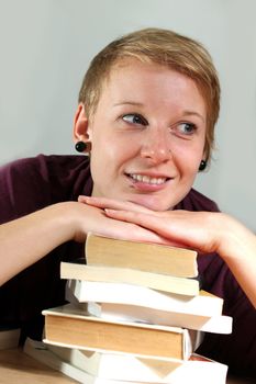 girl with books is thinking