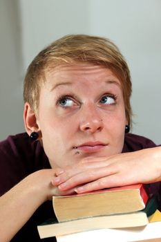 girl with books is thinking