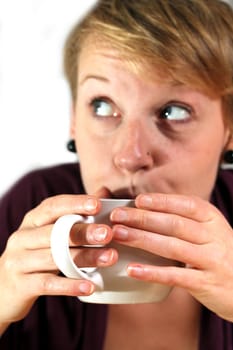 girl is drinking from a cup