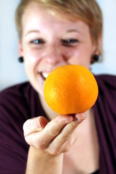 girl balancing an orange