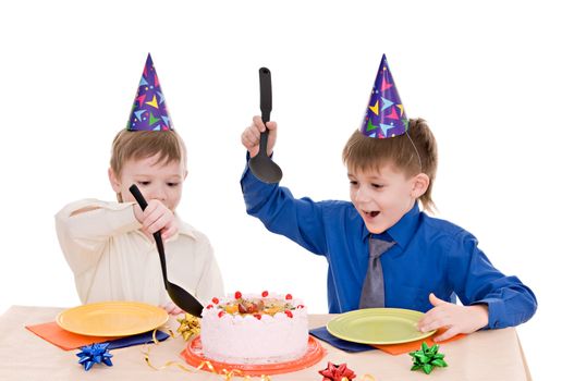 two happy boy with a cake isolated on white background