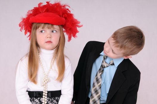 sad girl in a red hat waiting for an apology from the boy