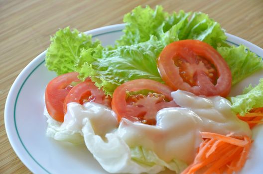 Fresh organic salad with cream sauce