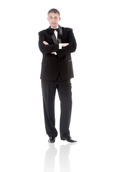 The elegant man in a classical tuxedo on a white background