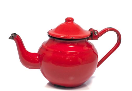 old metal red tea pot isolated on white