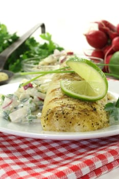 Potato salad with fresh herbs and hake fillet
