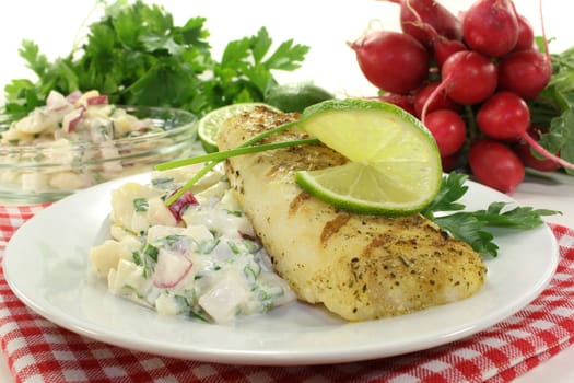 Potato salad with fresh herbs and hake fillet