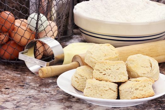 Country biscuits with fresh butter, eggs and flour. Shallow depth of field. 