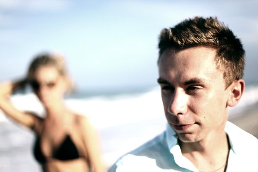girl and boy on ocean beach