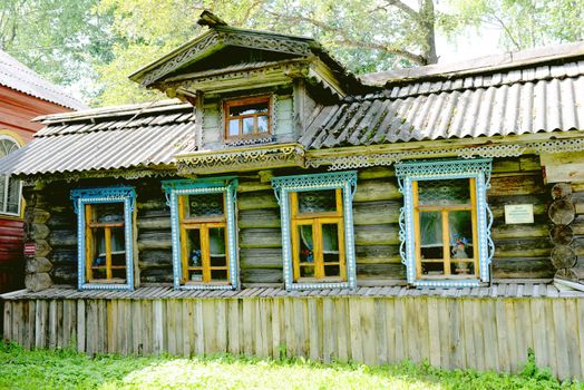 Traditional old Russian windows carved platband of wood house