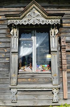 Traditional old Russian window carved platband of wood house