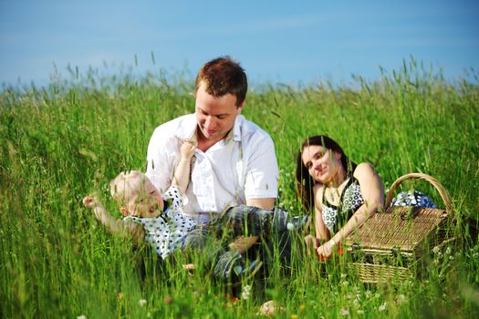  happy family on picnic in green grass