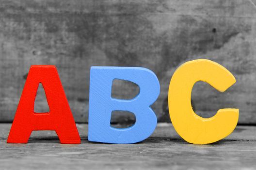 wooden letters on wooden background