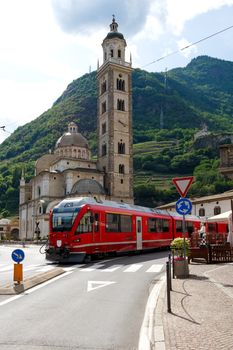 Swiss mountain train Bernina Express arrive at Italian city Tirano