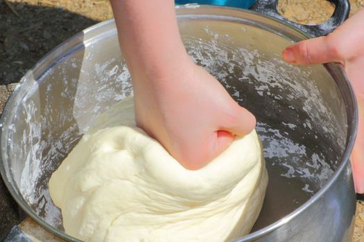 making dough outside for a homemade cake