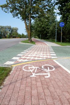 paved bicycle path crosses the street