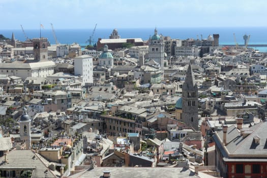 Panorama of the Italian city of Genoa. On a background gulf of Genoa of Ligurian sea and seaport are visible