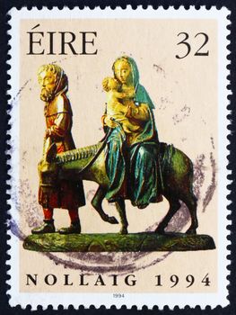 IRELAND - CIRCA 1994: a stamp printed in the Ireland shows Flight into Egypt, 15th Century Wood Carving, Christmas, circa 1994