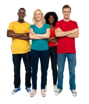 Team of young people standing with crossed hands against white background