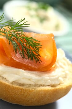 Smoked salmon and cream cheese canape garnished with dill (Selective Focus, Focus on the front of the dill)