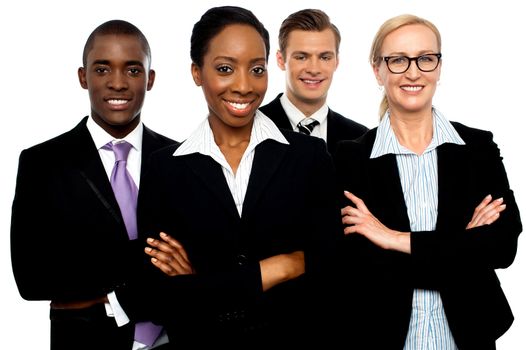 Portrait of team of business associates posing with arms crossed