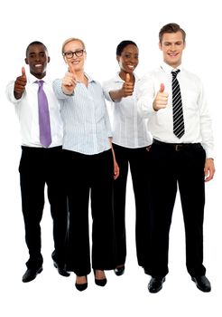 Full length shot executives showing thumbs up isolated over white
