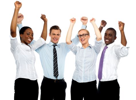 Business team of four celebrating success with arms raised isolated against white background