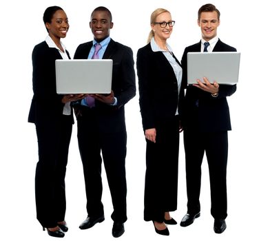 Two business teams posing with laptop over white background