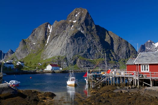 Picturesque fishing town of Reine on the coast of fjord on Lofoten islands in Norway