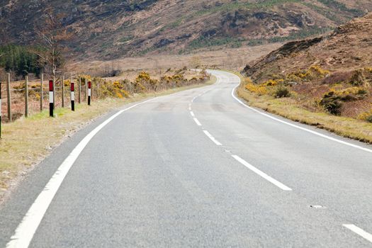 Empty road stretching out into the distance Highlands Scotland UK