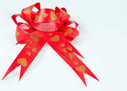 Red bow ribbon on white background pattern heart