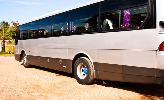 Wheels bus from the side view of the car.