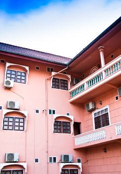 Pink hotel for tourists who travel to the suburbs of Laos.