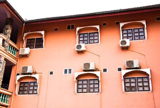 Pink hotel for tourists who travel to the suburbs of Laos.