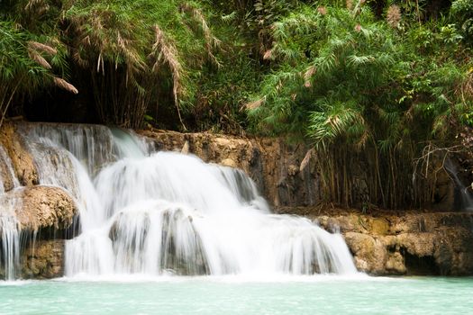 Waterfall and blue stream in the forest Laos