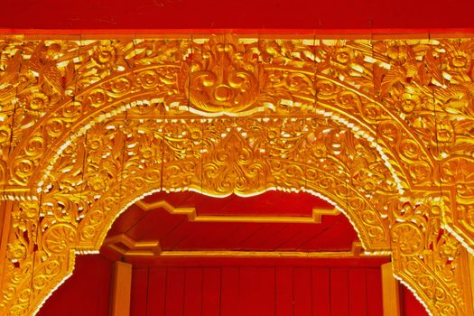 Stock Photo - Carvings On The Doors Of The Temple In The Novel In A Thai Temple